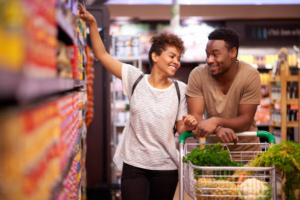 Shot of a young couple shopping in a grocery store